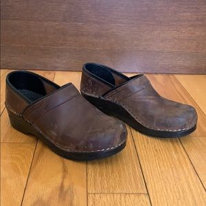 Distressed Sanita brown clogs